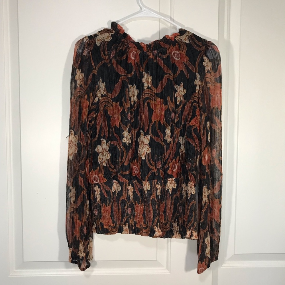 Sheer long sleeve black and orange floral blouse with smocked waist